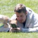 Justin Bieber Soaks Up The Sun On The Lawn With His Pup