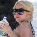 Lindsay Lohan Eats Salad Poolside In Miami